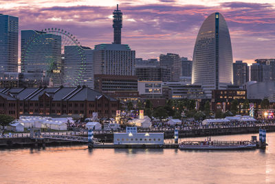 Modern buildings in city at sunset