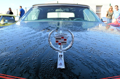 Close-up of wet car in city during rainy season