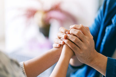 Close-up of hand holding hands