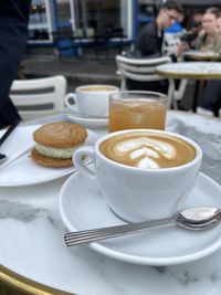 Cup of coffee on table at cafe