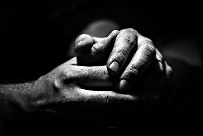 Close-up of man holding hands