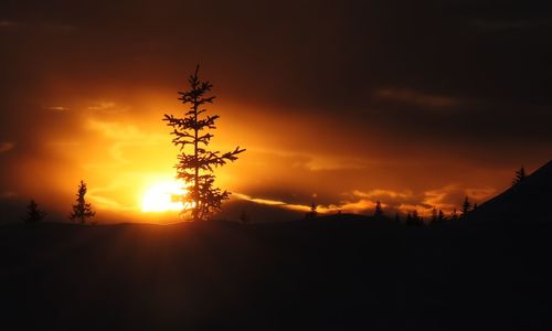 Scenic view of silhouette landscape against romantic sky at sunset