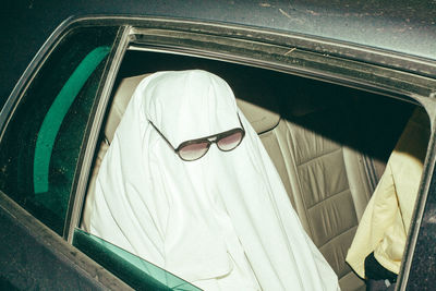 High angle view of man wearing sunglasses at home