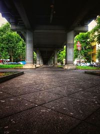 Empty street amidst buildings in city