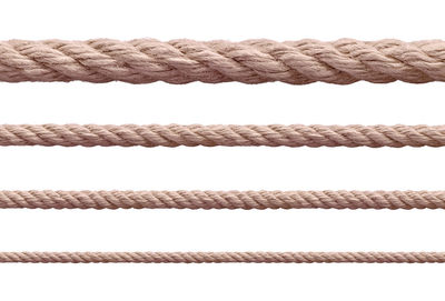 Close-up of rope against white background