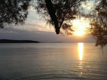 Scenic view of calm sea at sunset