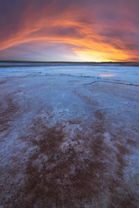 Scenic view of salty lagoon located near sea in penahueca under sundown sky