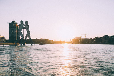 View of river with buildings in background