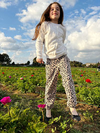 Young woman standing on field