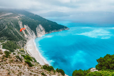 Idyllic shot rocky cliff by sea