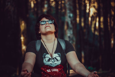 Portrait of young woman in forest