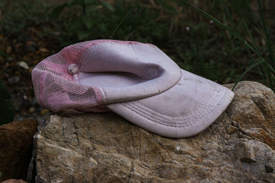 Close-up of shoes on rock