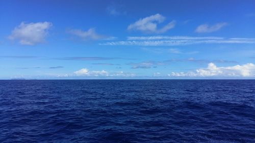 Scenic view of sea against blue sky