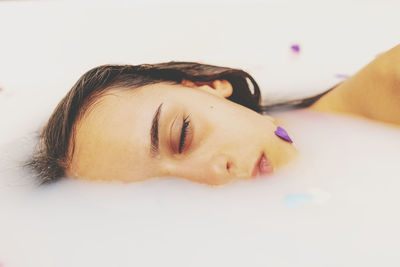 Portrait of young woman lying down