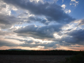 Scenic view of dramatic sky over land