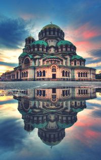 Alexander nevsky church against cloudy sky during sunset