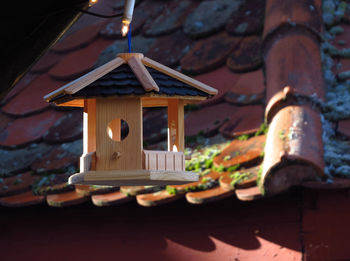Close-up of birdhouse against temple