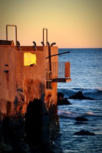 Scenic view of sea at sunset