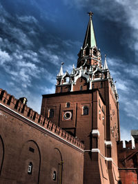 Low angle view of church against cloudy sky