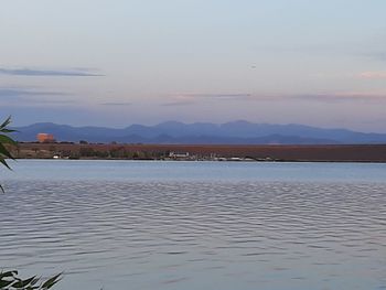 Scenic view of lake against sky during sunset