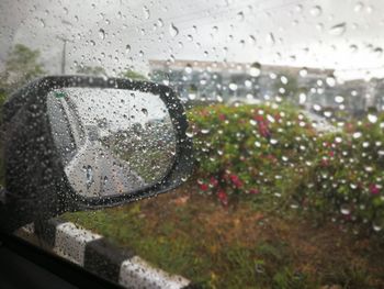 Close-up of raindrops on car window