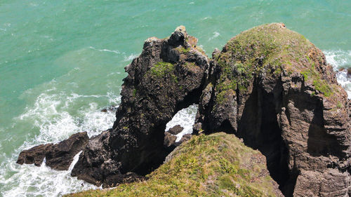 High angle view of rock formation and sea