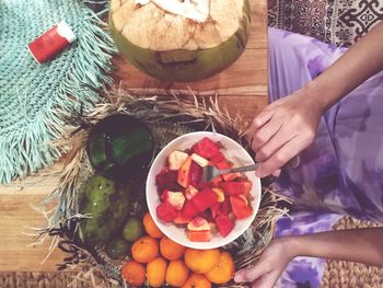 High angle view of woman preparing food on table