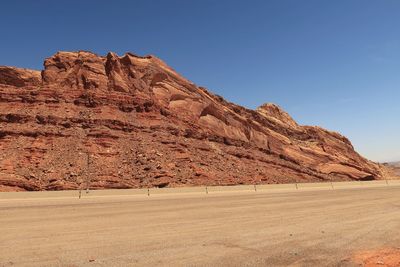 Landscape of multi colored barren rock formations along the road in the san rafael swell
