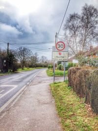 View of road against cloudy sky