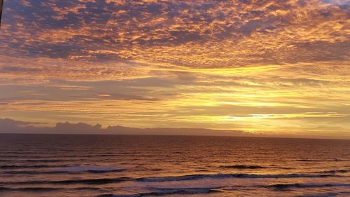 Scenic view of sea at sunset