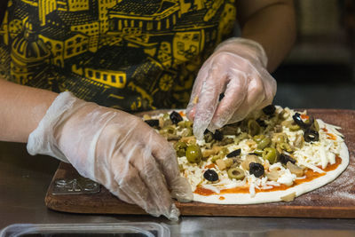 Close-up of man preparing food