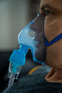 Close-up of man wearing protective mask