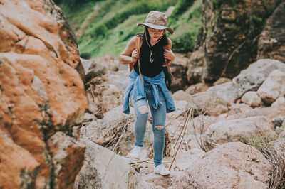 Woman standing on rock