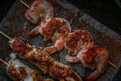 High angle view of meat on barbecue grill