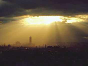 Silhouette of city at sunset