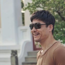 Portrait of  a happy man wearing sunglasses