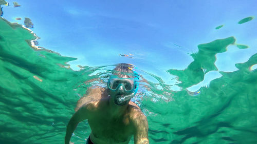 Man swimming in sea