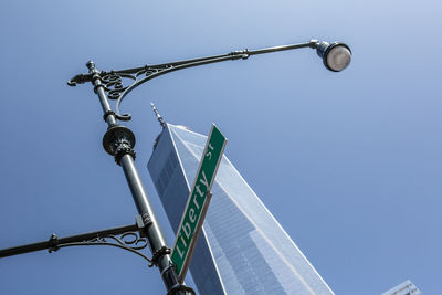 Low angle view of basketball hoop against clear blue sky