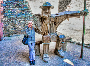 Full length portrait of man standing outdoors