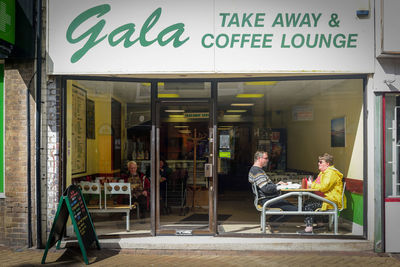 People sitting on chair at store