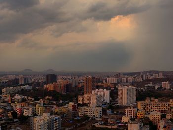 High angle view of buildings in city against sky