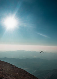 Sun shining over mountain