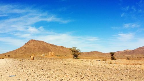 View of desert against blue sky