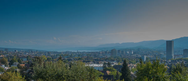 High angle view of trees and buildings against sky