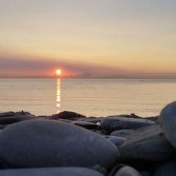 Scenic view of sea at sunset