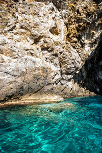 Scenic view of rock formation in sea