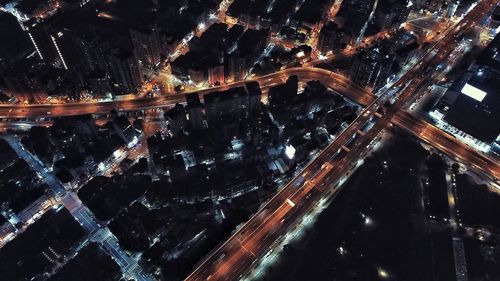 Aerial view of illuminated city at night