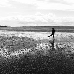 Silhouette of person on beach