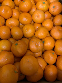 Full frame shot of oranges at market stall