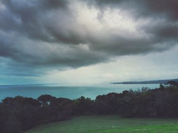 Scenic view of sea against cloudy sky